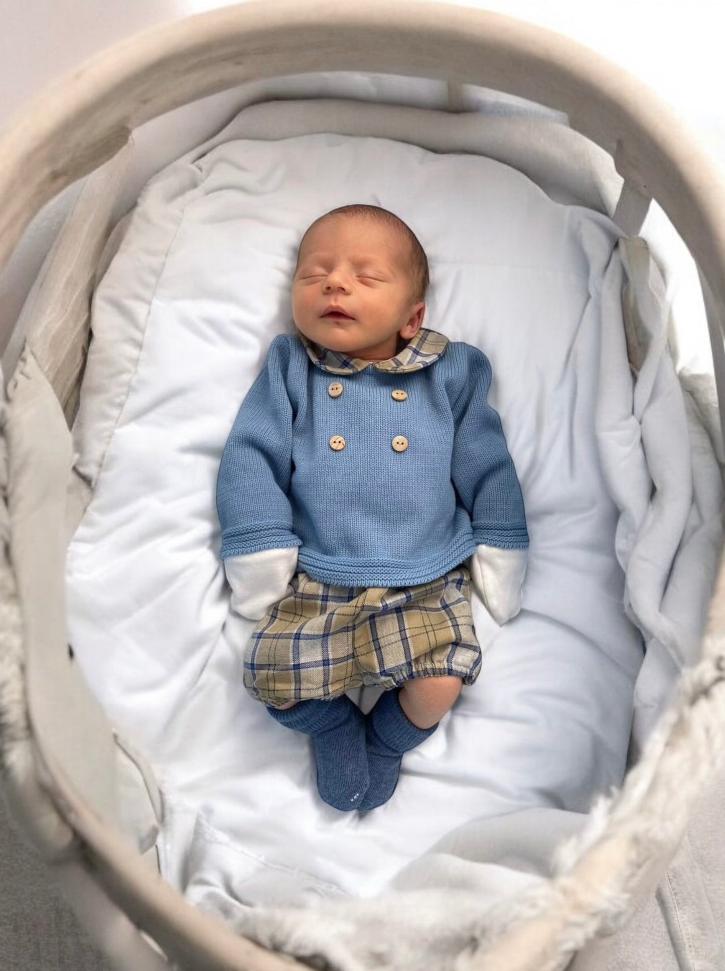 Baby boy outfit with knitted dusky blue top with tartan Peter Pan collar and coordinating tartan shorts.