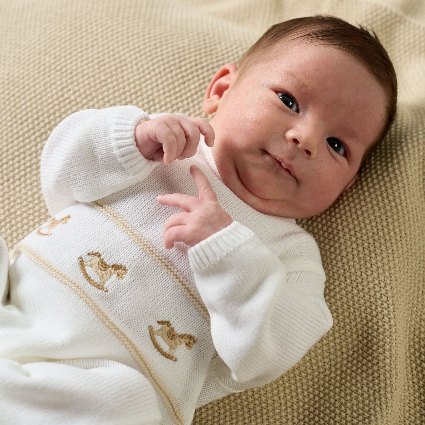 Rocking horse knitted onesie