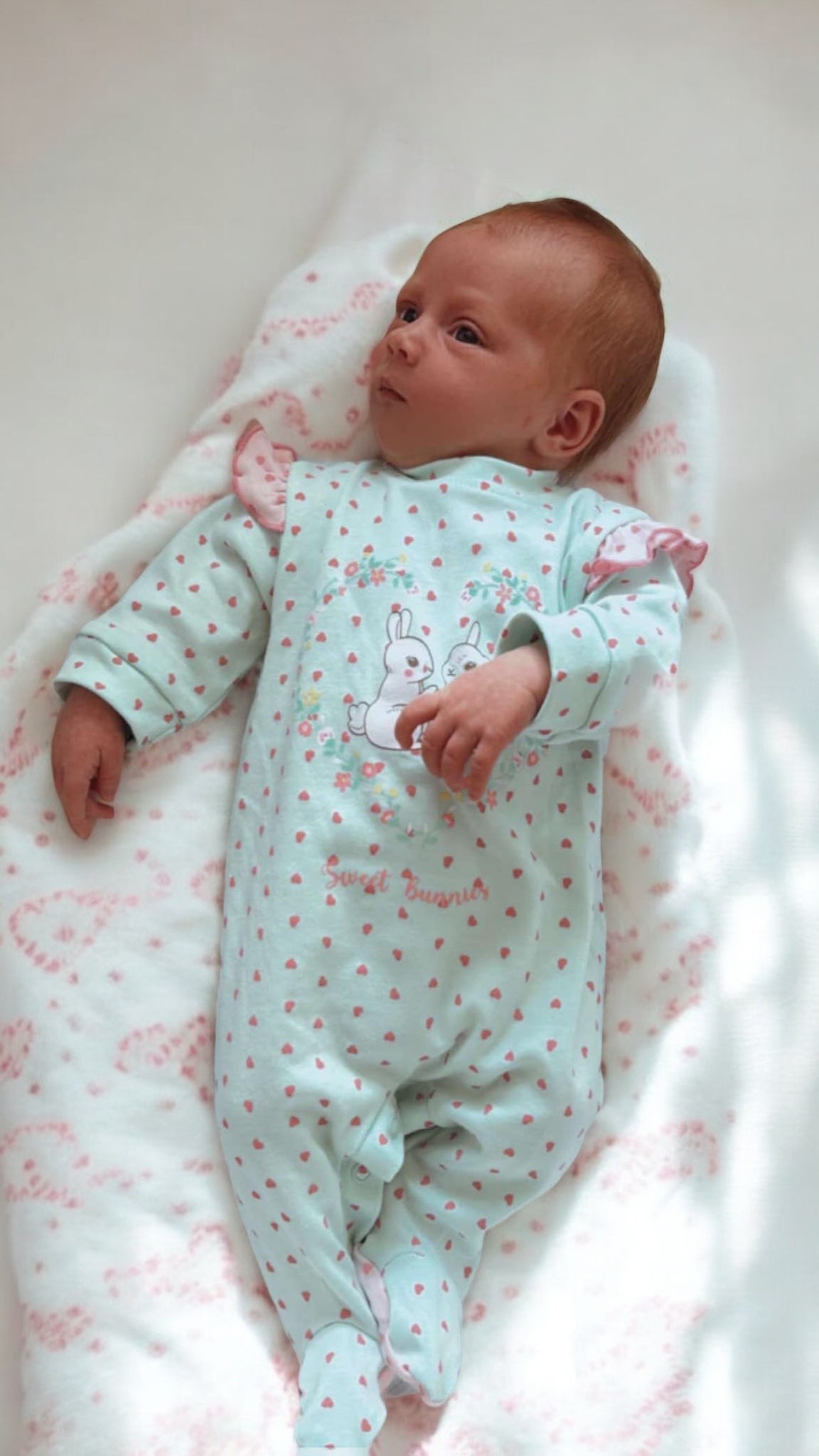 Baby sleep suit with frill shoulder and heart design