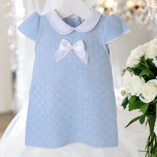 An elegant baby girls dress, made from supersoft lightweight pastel blue yarn. 