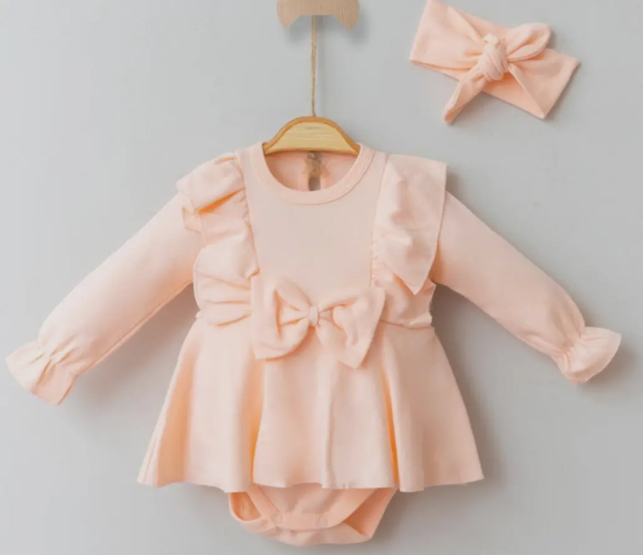 Baby girl skirt romper with ruffles and bow