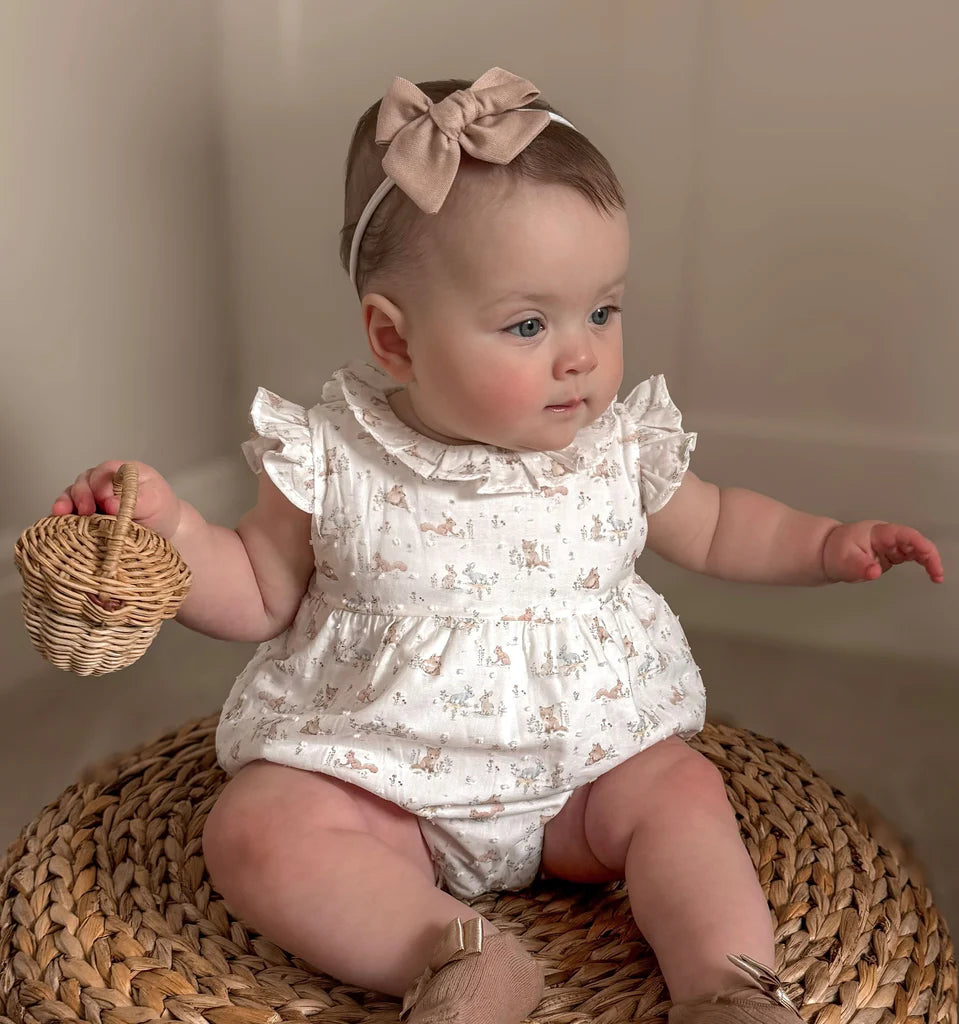 Baby girl romper with adorable little woodland animal pattern.