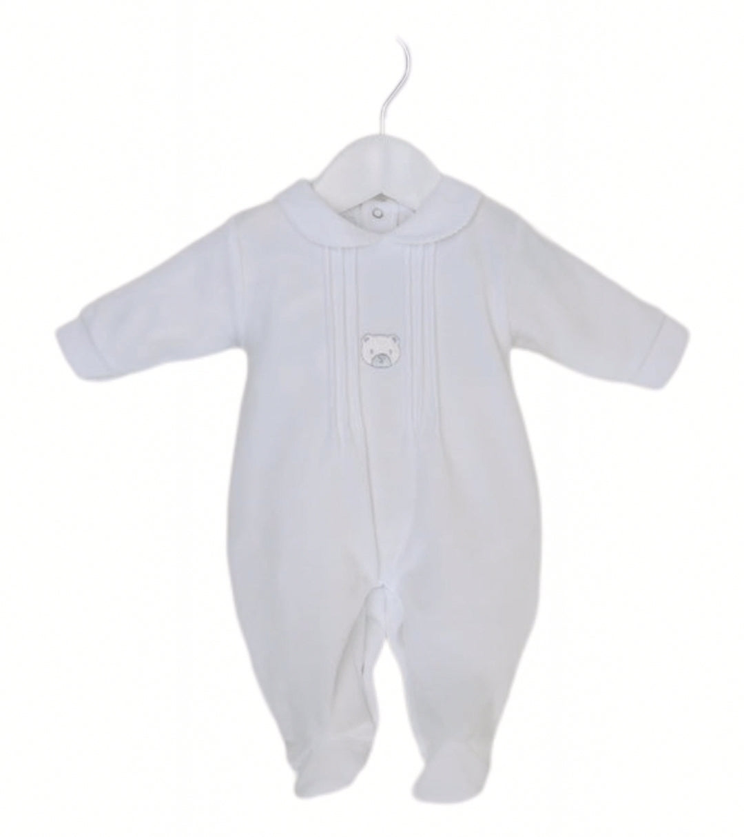 White bear velour baby sleepsuit displayed on a hanger, showing the full shape and detailing