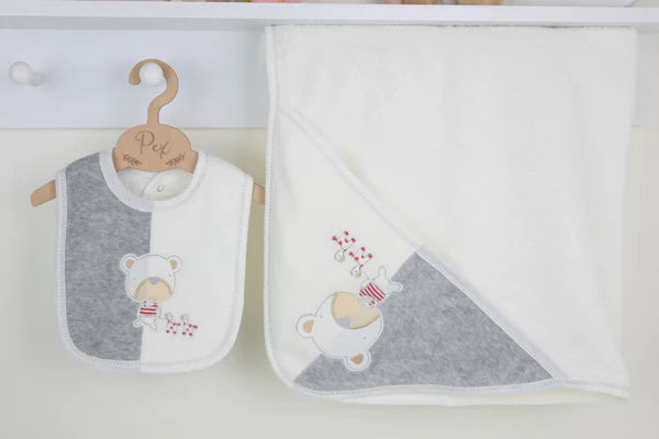 Hooded baby towel and matching bib from the Playtime 3 piece baby bundle, shown together